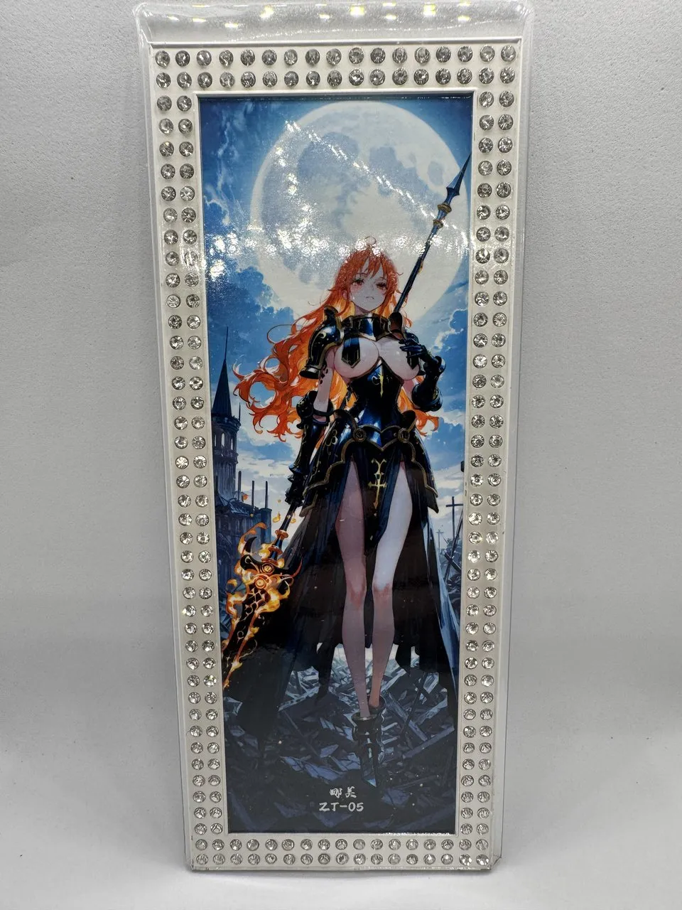 An oversized panoramic One Piece metal card of Nami with a hand-applied rhinestone border, a case prize serialized 09/35