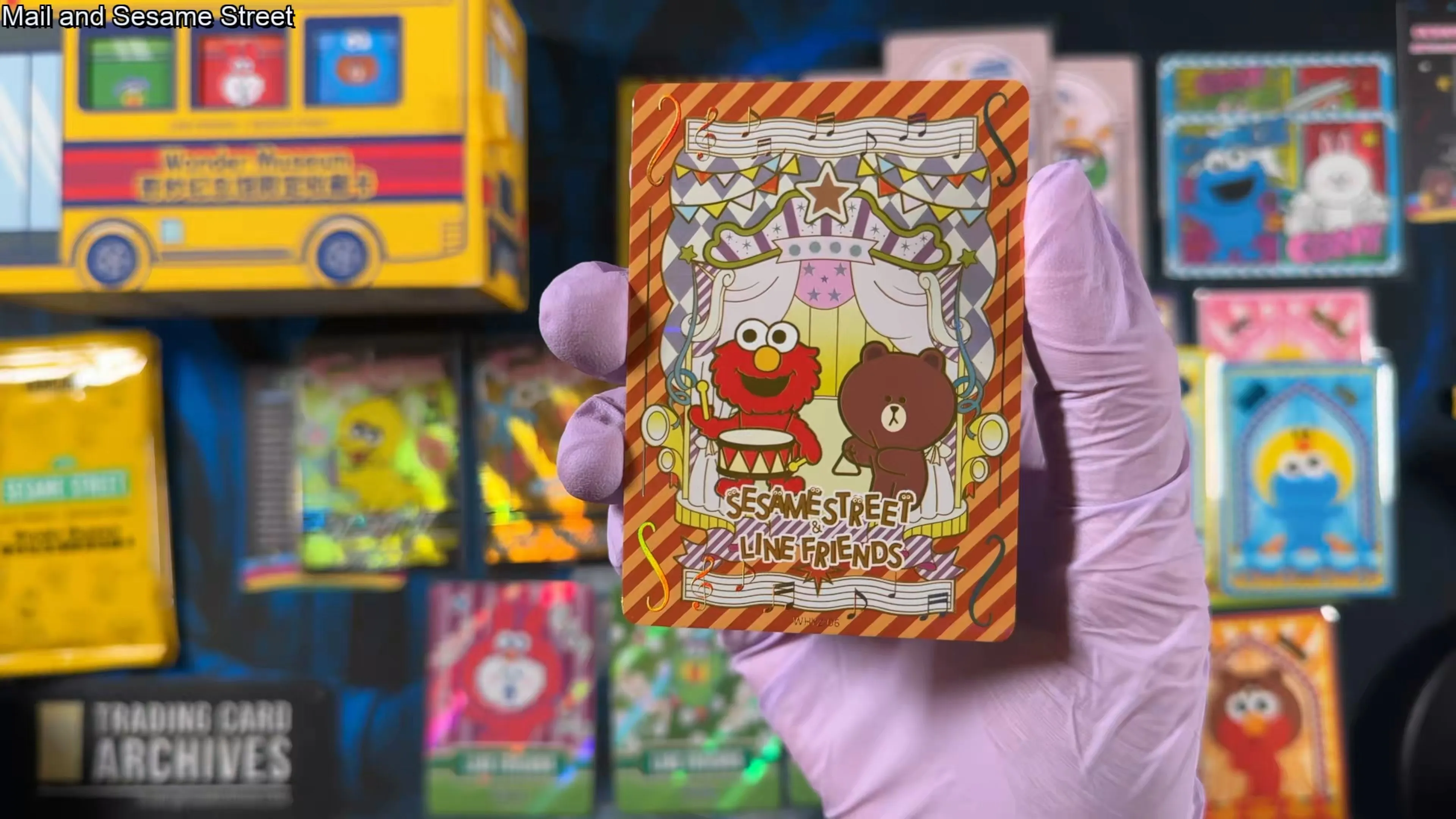 A music-themed card with Elmo on drums and Brown the bear, gold-bordered, marked Sesame Street & LINE Friends