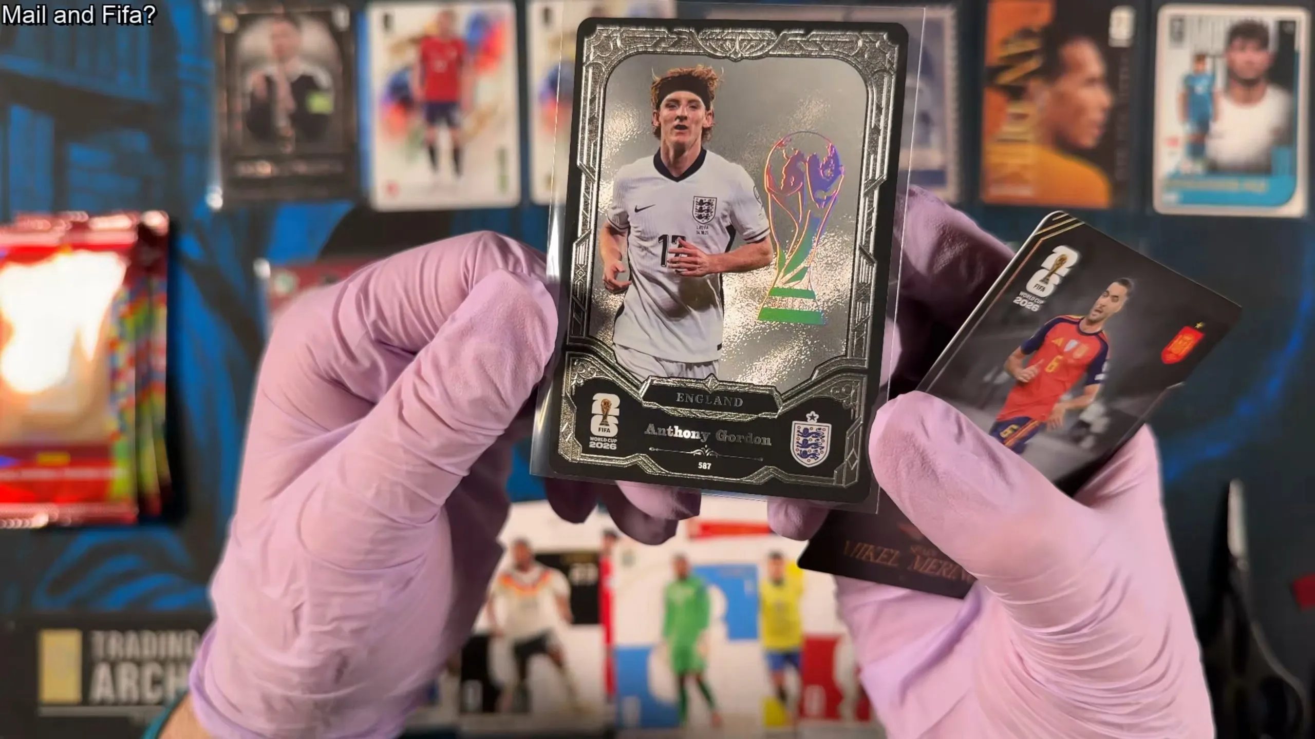A silver framed England card of Anthony Gordon with a holographic World Cup trophy foil