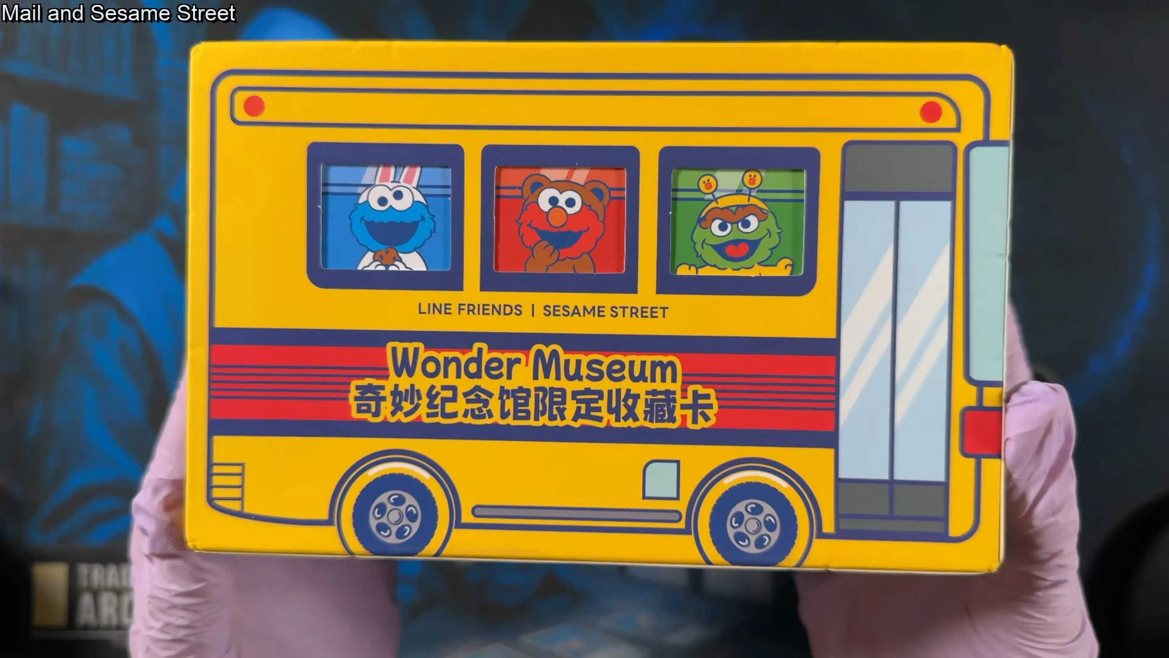 The Vancards Wonder Museum box, designed like a yellow school bus with Cookie Monster, Elmo, and Oscar the Grouch in the windows