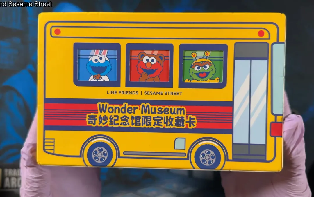 The Vancards Wonder Museum box, a yellow school bus with Cookie Monster, Elmo, and Oscar the Grouch in the windows