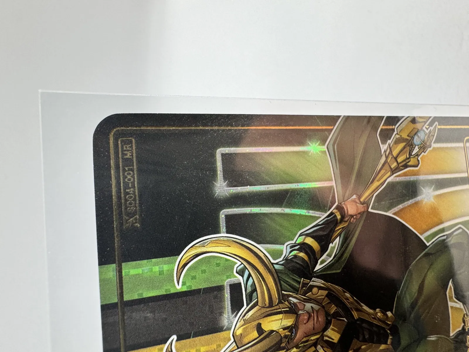 Close-up of the top corner of the Loki MR card showing the card code SC04-001 MR