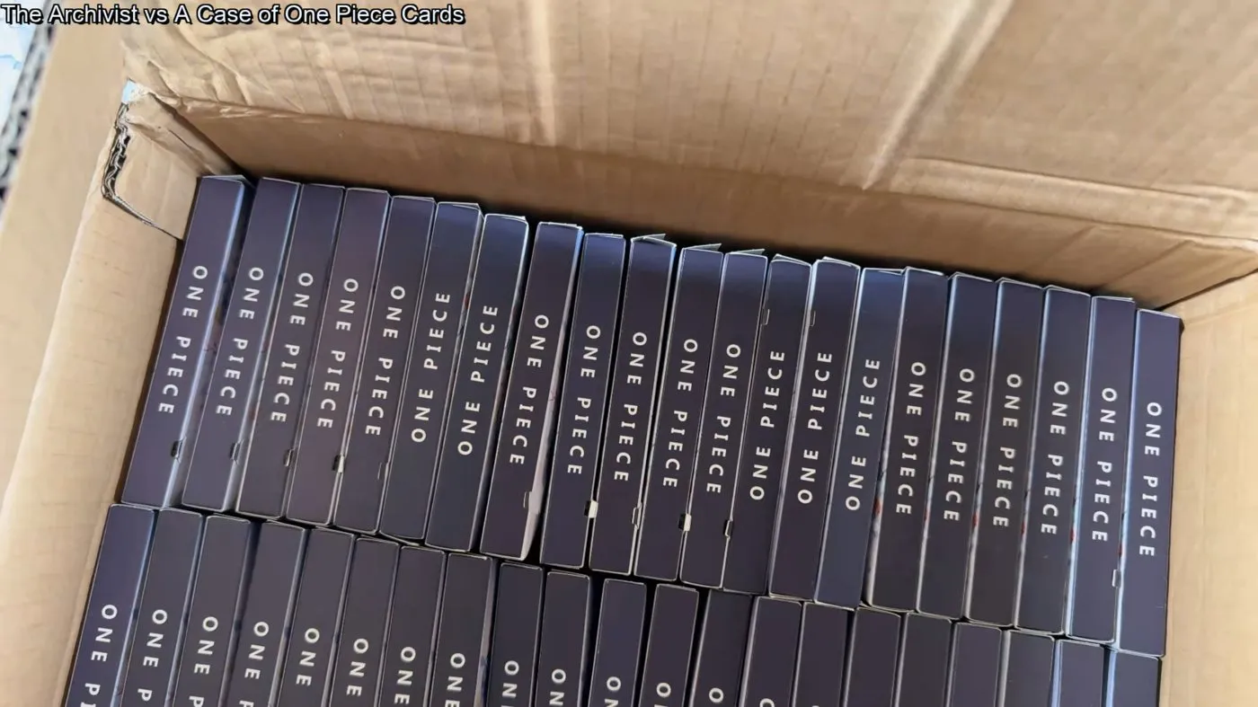 A full case of One Piece metal cards — 48 small black boxes packed into a shipping crate